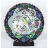 A Japanese charger decorated with cherry blossom, peonies and an exotic bird 36cm dia.