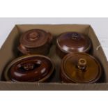 Four earthenware lidded pots