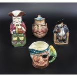 Four assorted character jugs