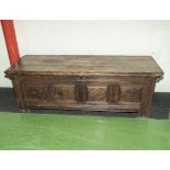 A large period oak coffer/linen chest with four carved panels to the front 68" x 23" Provenance -