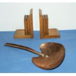 A beaten copper Arts and Crafts chestnut roaster and a pair of bookends