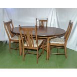 An Ercol dining table and four chairs