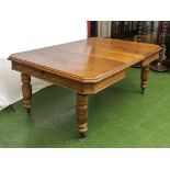 Victorian oak extending dining table with one extra leaf