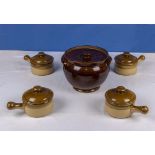 An earthenware pot and four lidded soup bowls