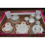 A box containing part tea sets