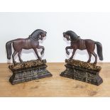 A pair of vintage cast iron door stops modelled as horses
