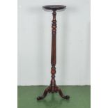 A 20th century mahogany torchere, 1.3m tall