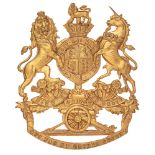 Royal Artillery Victorian helmet plate circa 1878-1901. Good die-stamped brass Royal Arms with