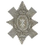 Scottish. Black Watch WW2 plastic glengarry badge. Good scarce Thistle star bearing crowned motto