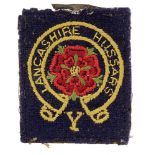 306 HAA Regiment Royal Artillery cloth formation sign. Dark blue rectangle embroidered with circular