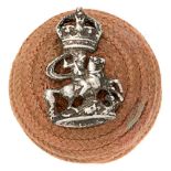 9th London Queen Victorias Rifles Officer pre 1953 salmon pink cord boss bearing silvered badge.