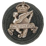 Irish. Royal Irish Rifles Officer pre 1921 green cord boss bearing silver badge. Badge being crowned