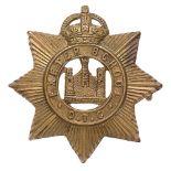 Exeter School OTC cap badge circa 1908-40. Good scarce die-stamped brass issue of Devonshire