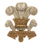 Irish. Leinster Regiment WW1 curled scrolls cap badge. Good scarce die-stamped brass Prince of Wales