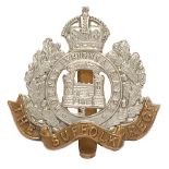 Suffolk Regiment Edwardian two tower cap badge. Good scarce die-stamped white meal crowned MONTIS