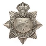 Trafalgar House School OTC Hampshire cap badge. Good rare die-stamped white metal crowned star