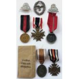 8 German Third Reich assorted medals and badges. 1939 War Merit Cross, 2nd Class with swords ...