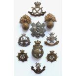 10 Victorian cap badges. 2 x Royal Fusiliers ... South Staffordshire ... East Lancashire ...