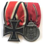 German Third Reich Iron Cross and Eastern Front pair of medals. Good 1939 Iron Cross 2nd Class