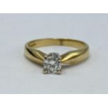 An 18ct gold, brilliant cut diamond solitaire ring, in a claw setting, approx 0.4ct, colour I/J