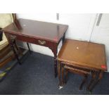 An Edwardian mahogany single drawer inset side table, together with a nest of three tables Location: