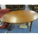 A Mackintosh teak extending oval dining table circa 1970 152cm long (198cm when extended) x 73.5cm h