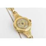A Swiss early 20th century ladies 18ct gold cylinder wristwatch. The dial signed T.R.F with
