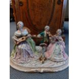 A Capodimonte figural group of 3 musicians in period costume signed A.Macins, 17cm w x 11cm d x 12cm