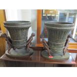 A pair of modern composition vases each with leaf ornament elevated by figures. 36.5cm h x 32cm w