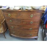 An early 19th century mahogany bow front chest of drawers with inlay to top and original locking