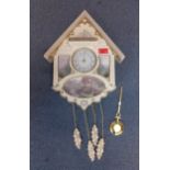 A late 20th century Bradford Editions cream painted cuckoo clock Location: RWF