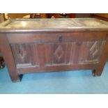 A mid 17th-late 17th century oak coffer, tri panelled on legs with internal candle box, 70cm h x