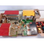 A vintage treen farm with buildings and figures, models and accessories together with tractors and