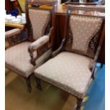 A pair of ladies and gentleman's walnut salon chairs with carved ornament, upholstered backs and