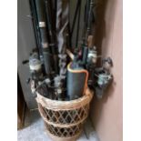 A collection of mixed fishing rods and reels