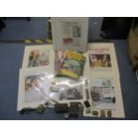 A mixed lot to include various mounted cigarette advertisement prints, vintage motoring magazines, a