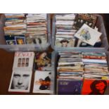 Three crates of assorted 7" singles to include 1970's/80's/90's artists, Human League and Phil