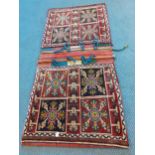 A North African red ground woollen camel bag with images of flora Location: RWB