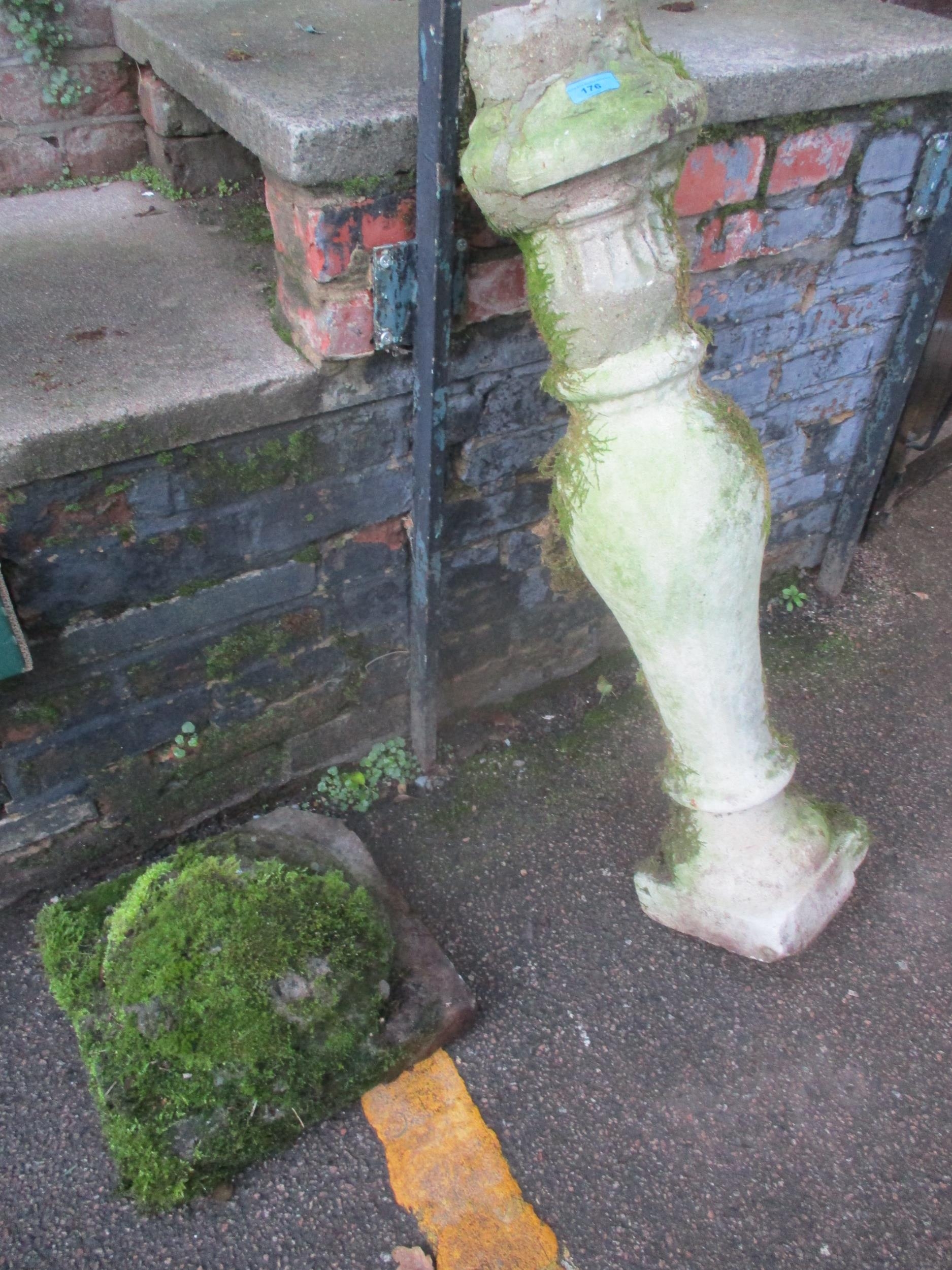 A weathered garden stone pillar on a square base A/F