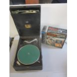 A black cased HMV wind-up gramophone with a couple of 78rpm records, and a boxed Binatone TV