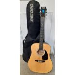 A Stagg acoustic guitar, model SW203W with padded travel bag and a folio of sheet music Location:RWB