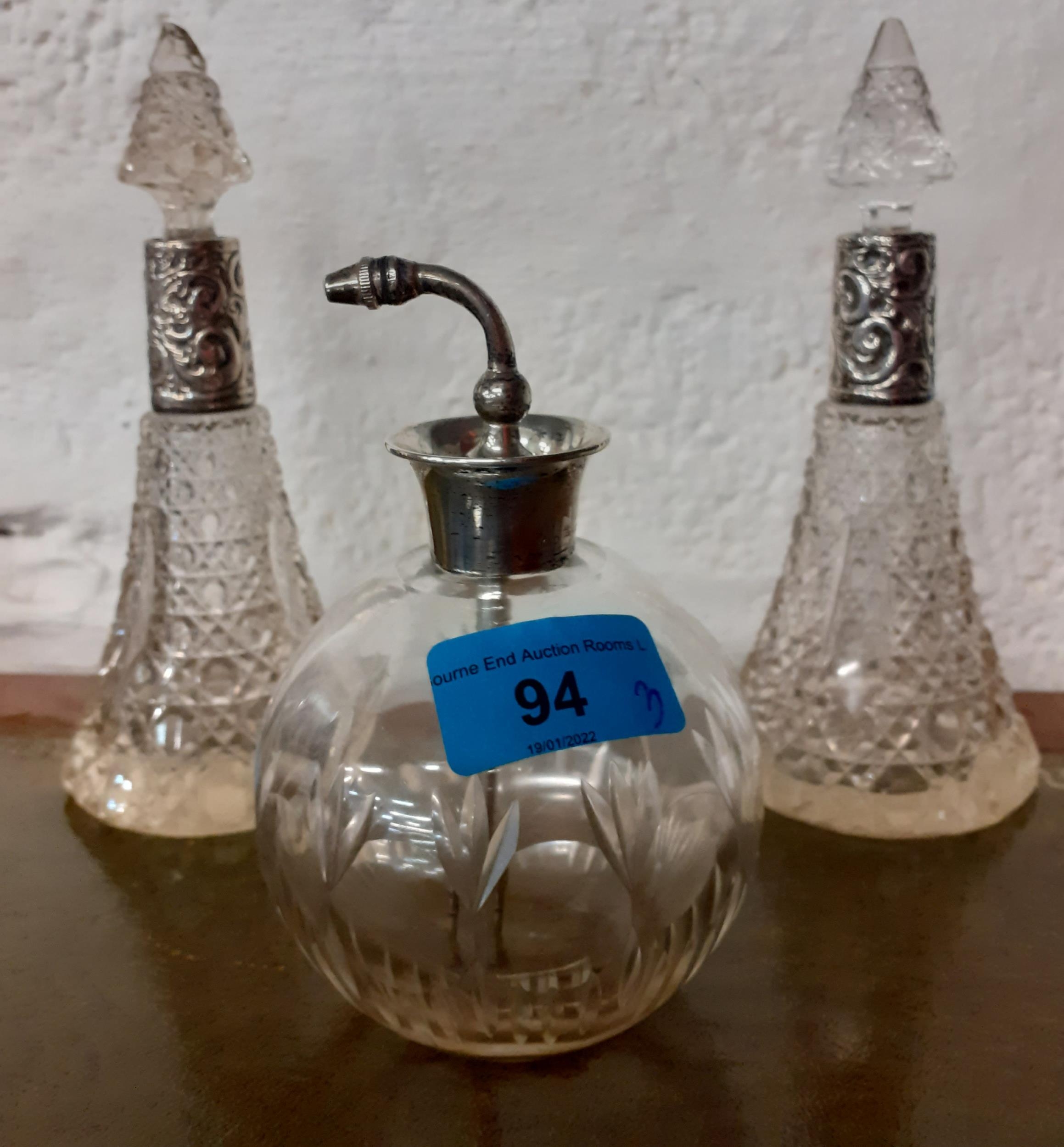 Three glass scent bottles with silver collars Location: RWB