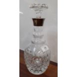 A cut glass decanter with silver collar, 29cm high Location: RWB