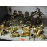 Mixed brassware to include ornaments of frogs, dolphins, camels and other items Location: G