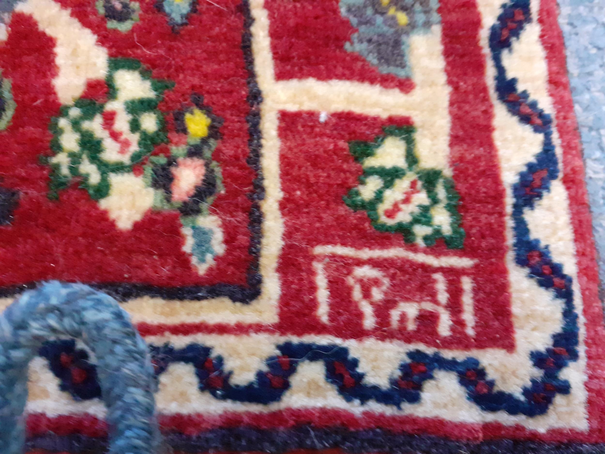 A North African red ground woollen camel bag with images of flora Location: RWB - Image 3 of 4