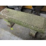 A garden composition bench on two scroll shaped supports, 47cm h x 117.5cm w Location: