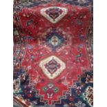 A large red ground Tabriz carpet, 200cm x 120cm Condition: there is wear and tear to the carpet -