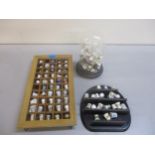 A collection of porcelain thimbles in display stands Location: 8.4