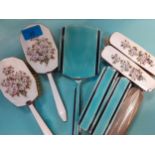 An Art Deco silver and green enamelled back hand mirror and 2 matching brushes A/F, together with