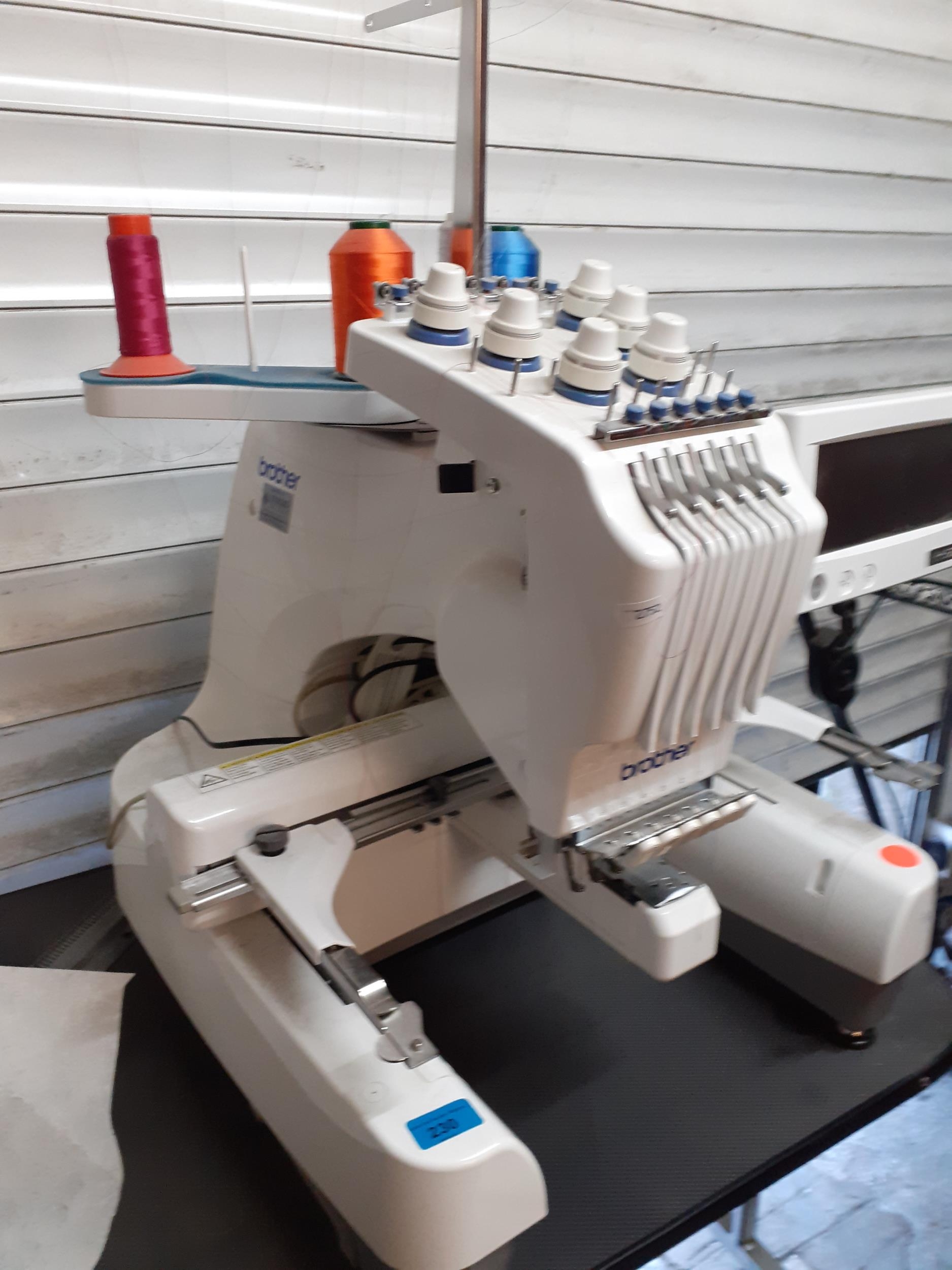 A Brother PR-620 professional embroidery machine with accessories, reels and a table (originally - Image 2 of 4